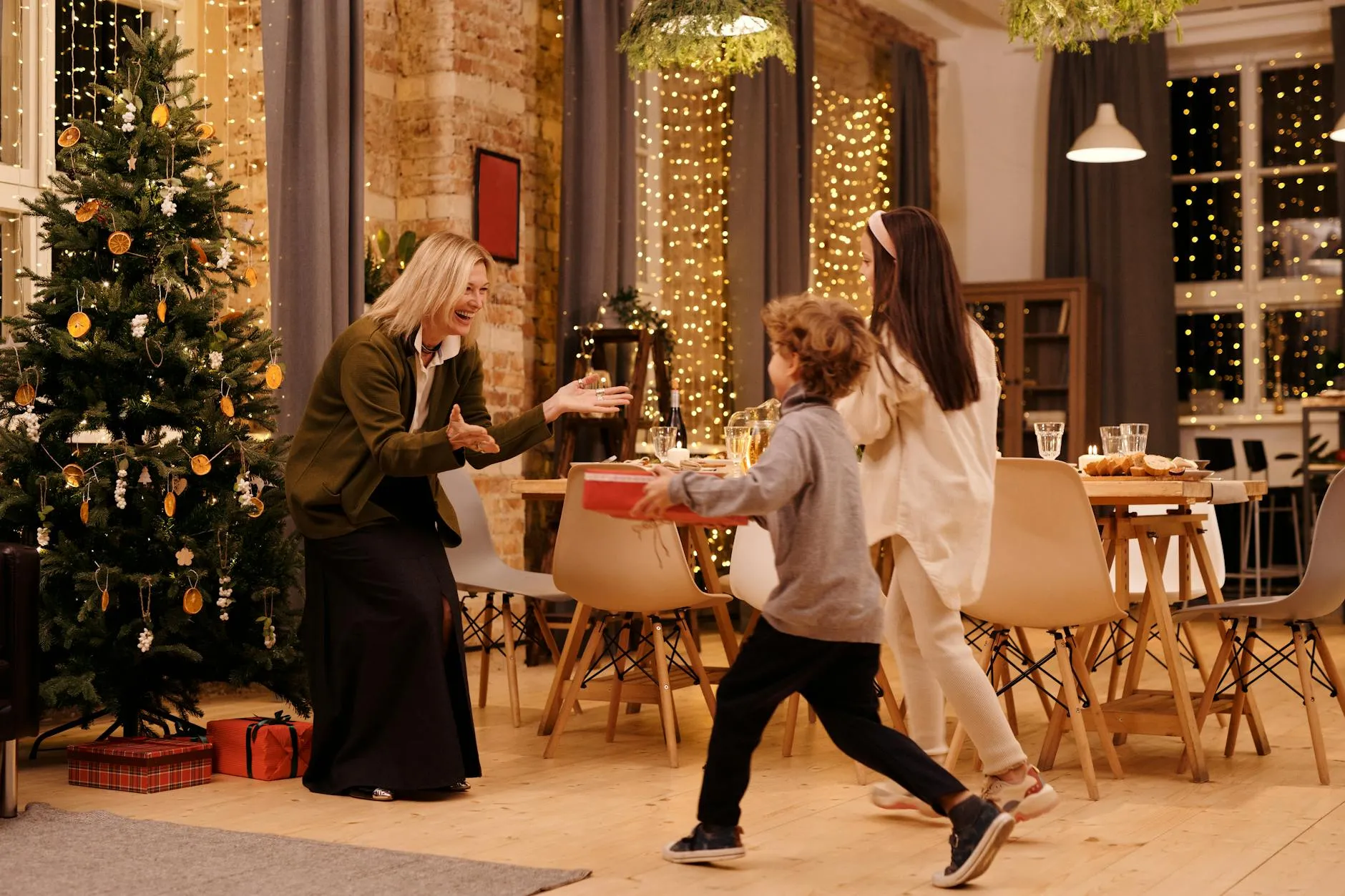 Family moment during the Christmas holidays, with golden Christmas lights in the background.