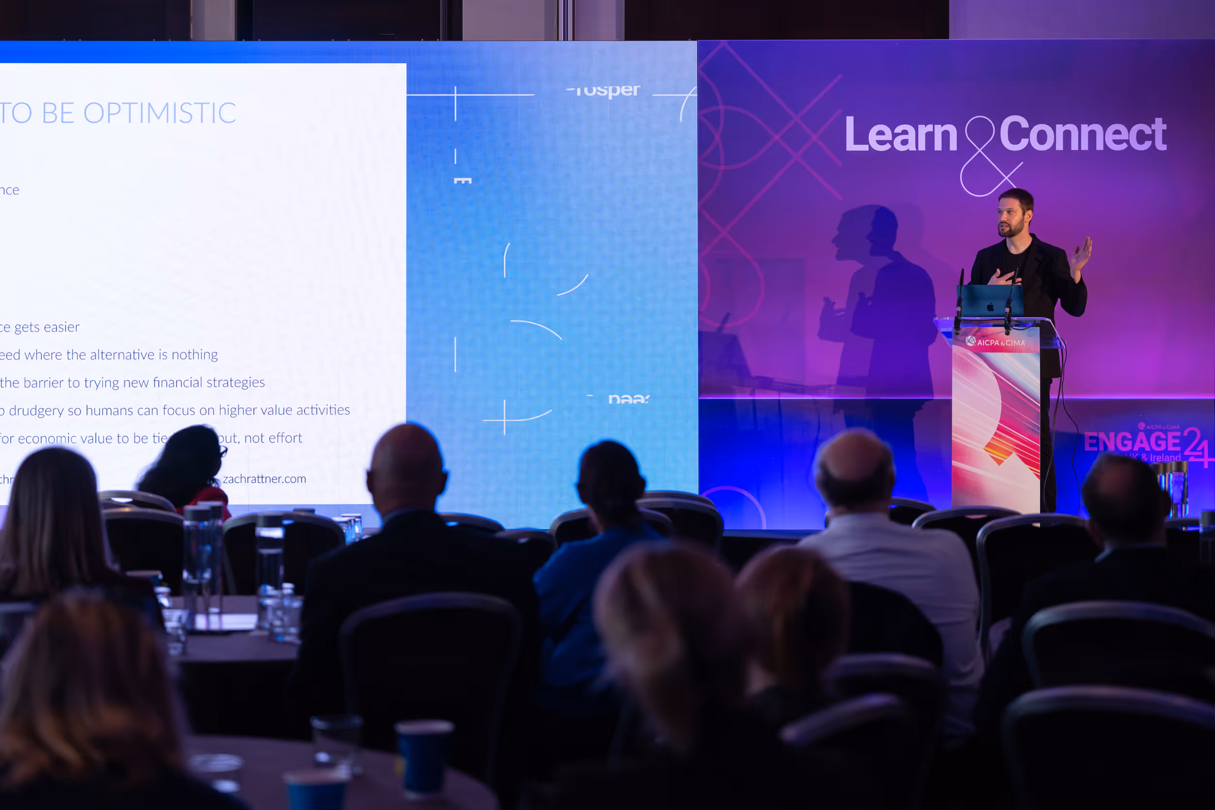 Zach Rattner on stage speaking at Engage 24