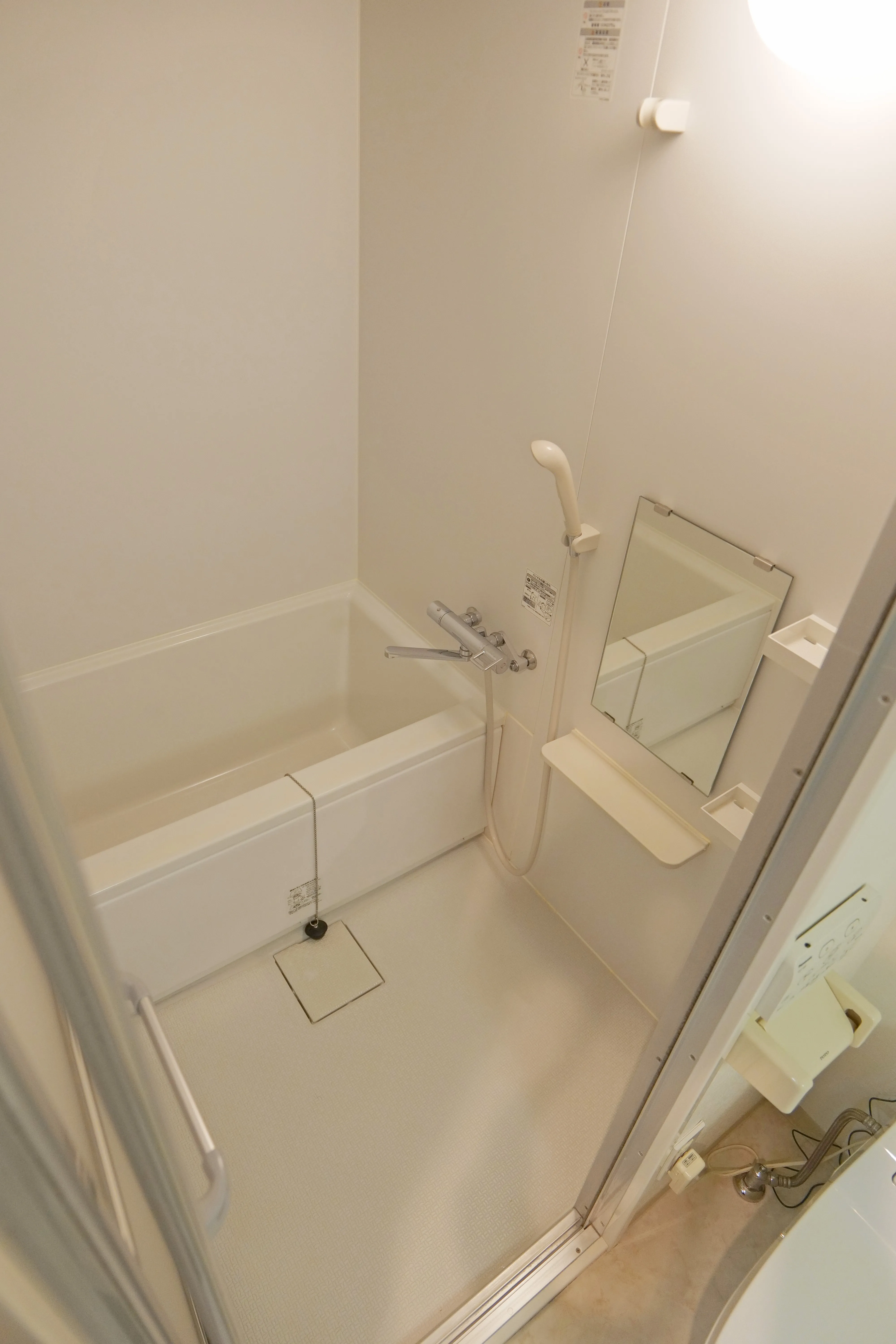 Bathroom with shower space and deep Japanese bathtub.