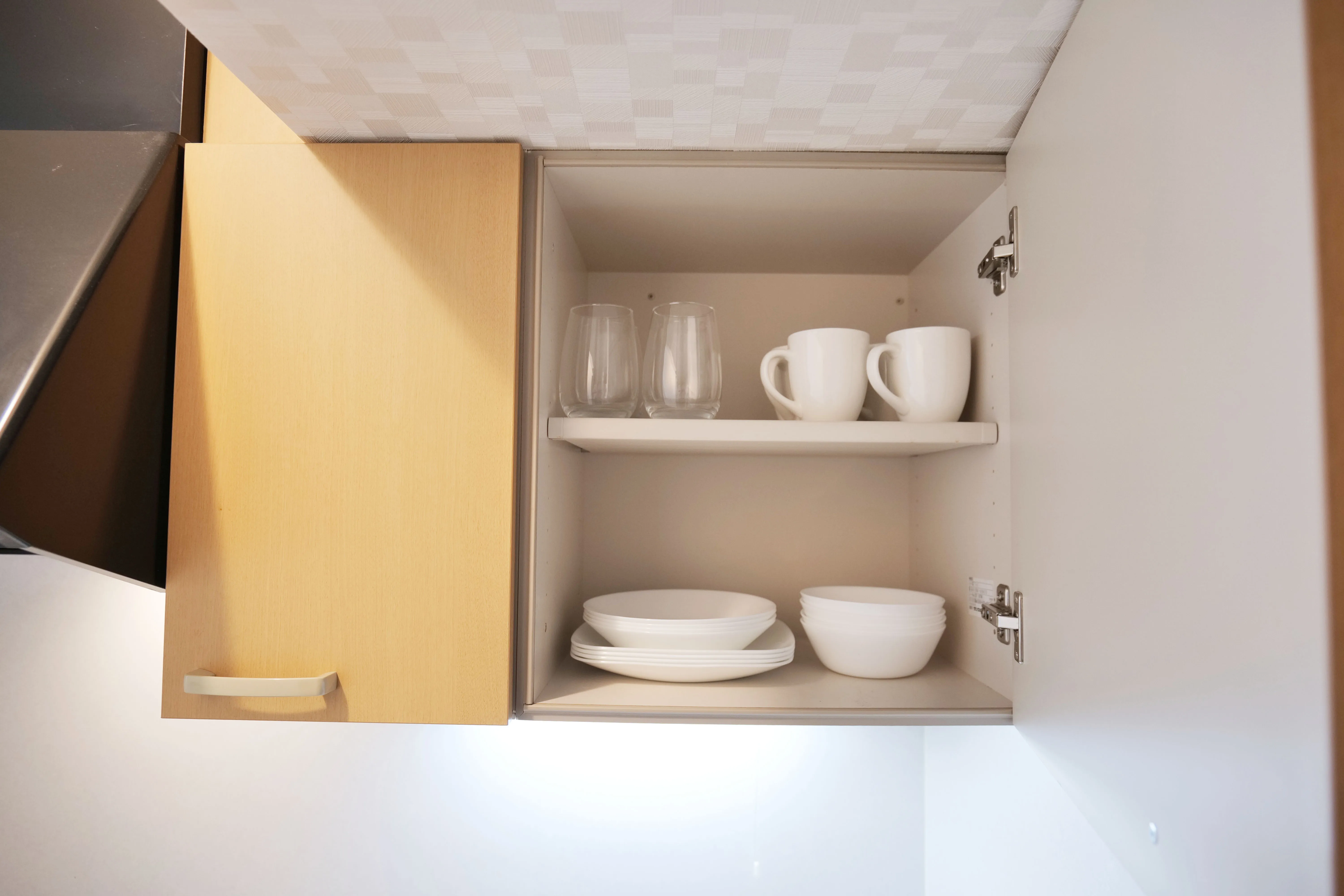Fully equipped kitchen with complete utensils, cookware, and dining ware — everything you need for home-style cooking and convenient meal preparation.