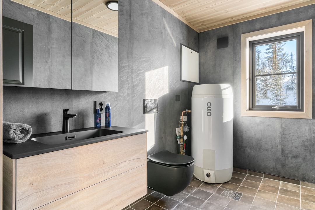 a large family sharing a meal in an Aurora home while appliances run in the background - what size water heater do i need