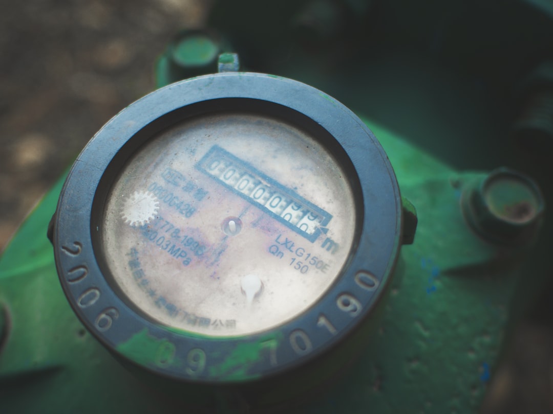 homeowner checking a water meter in a basement homeowner checking a water meter in a basement
