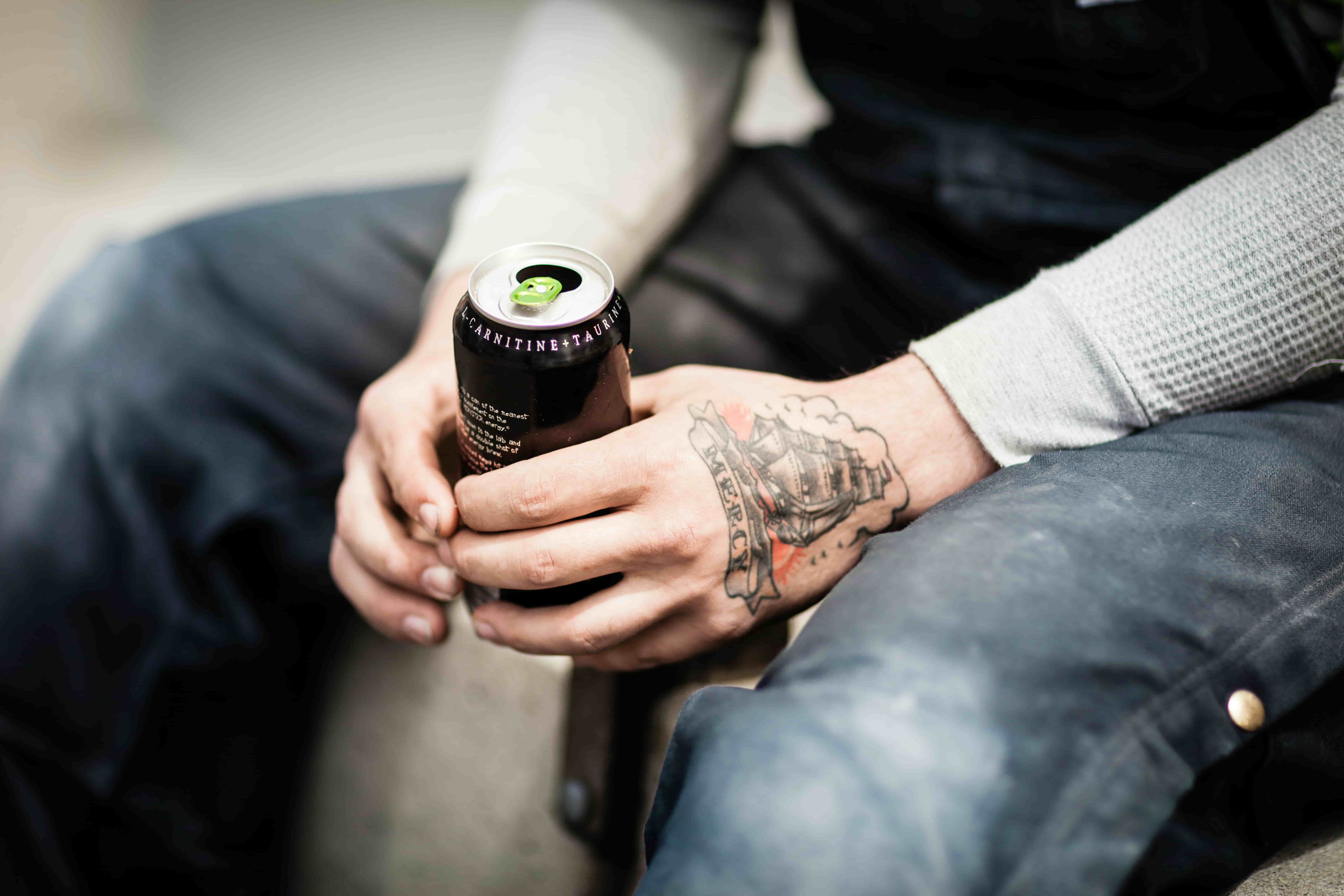 Water.Day_men sitting with energy drink