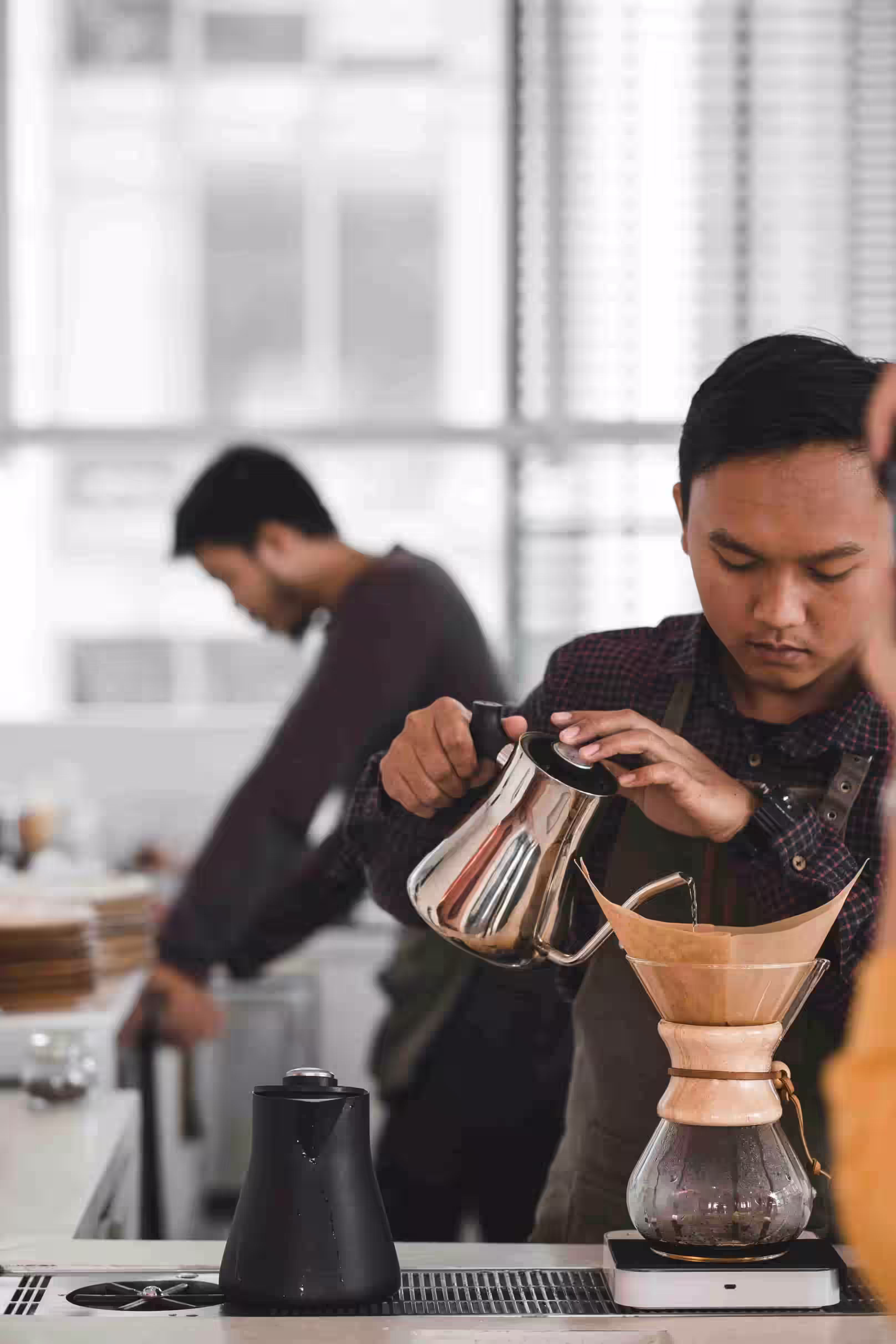 Water.Day_man fills coffee filter with water