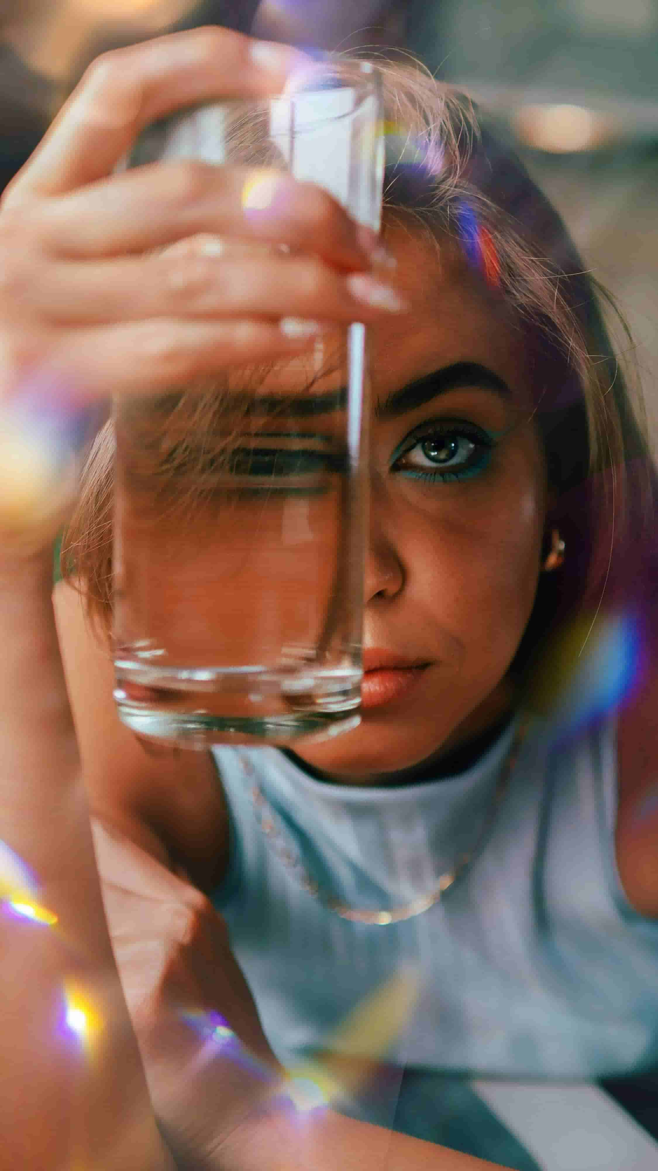 Water.Day_woman behind water glass