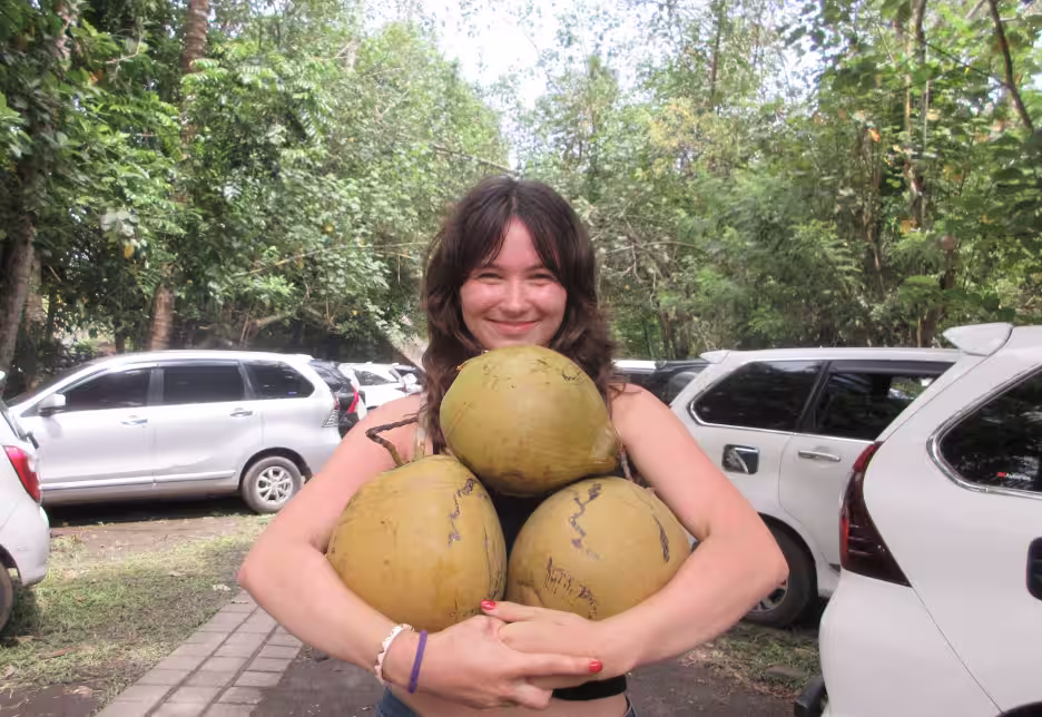 Zosia with harvested coconuts
