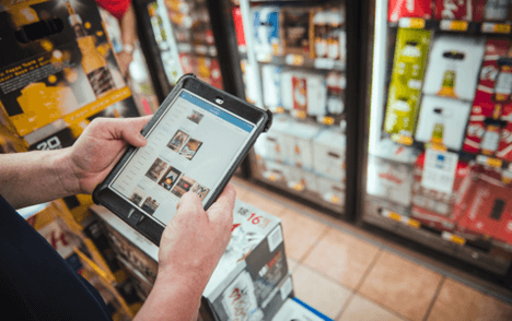Guy working on tablet in store