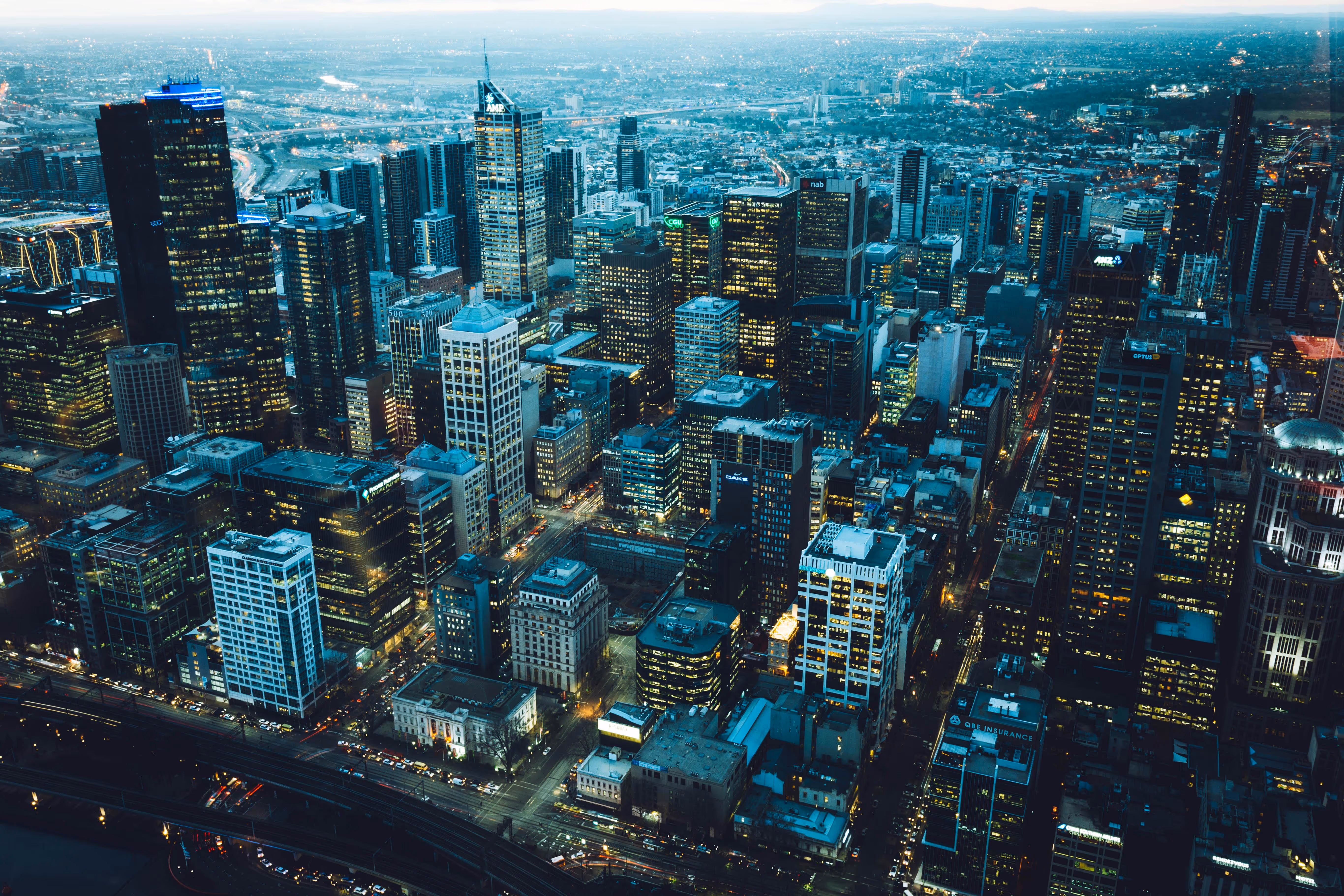 Aerial view of a city with high-rise buildings at night.