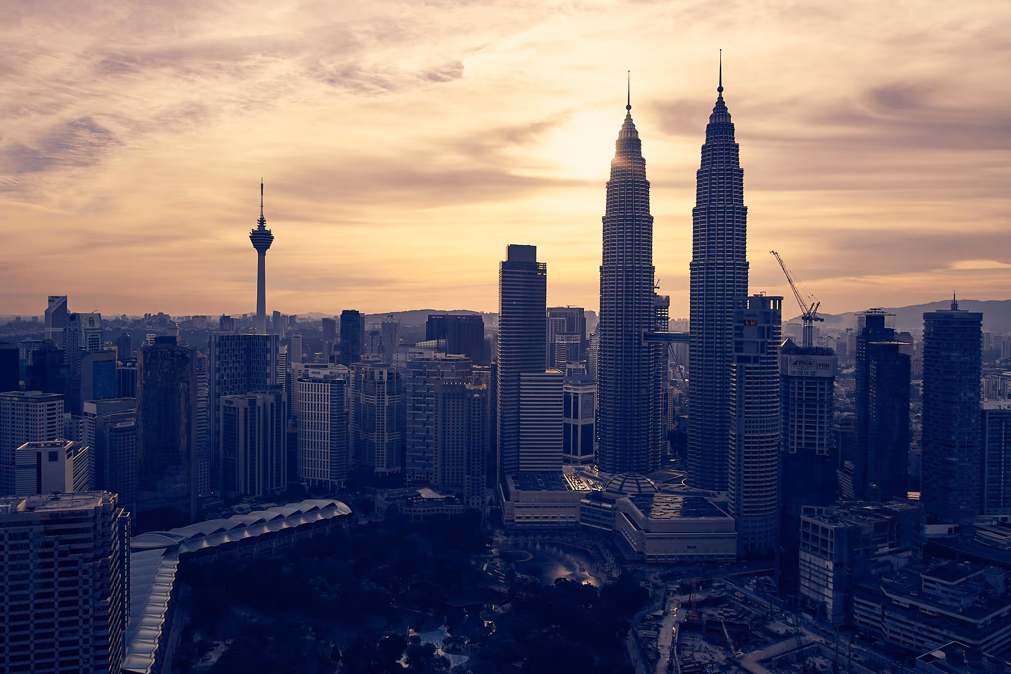 Skyline of Kuala Lumpur with the Petronas Towers at sunset.
