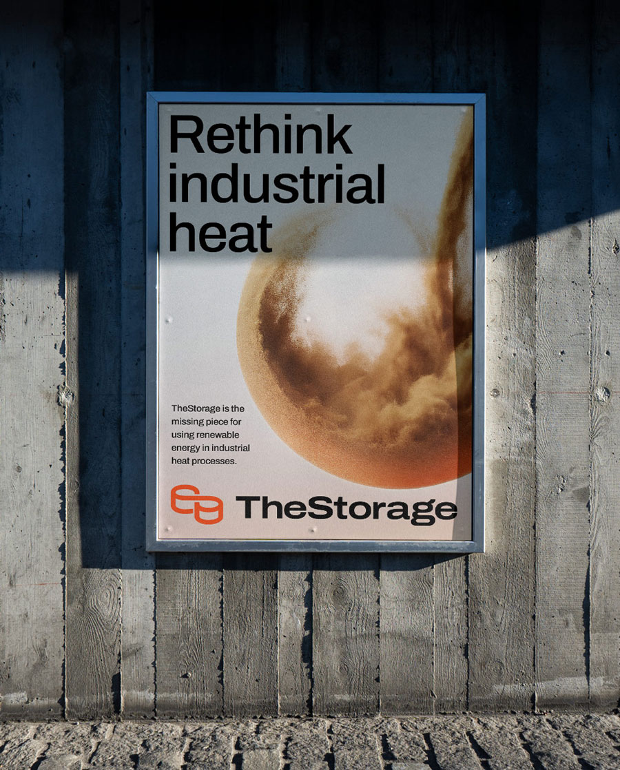 Outdoor framed poster on a concrete wall reading 'Rethink industrial heat' with a circular abstract design and TheStorage logo.