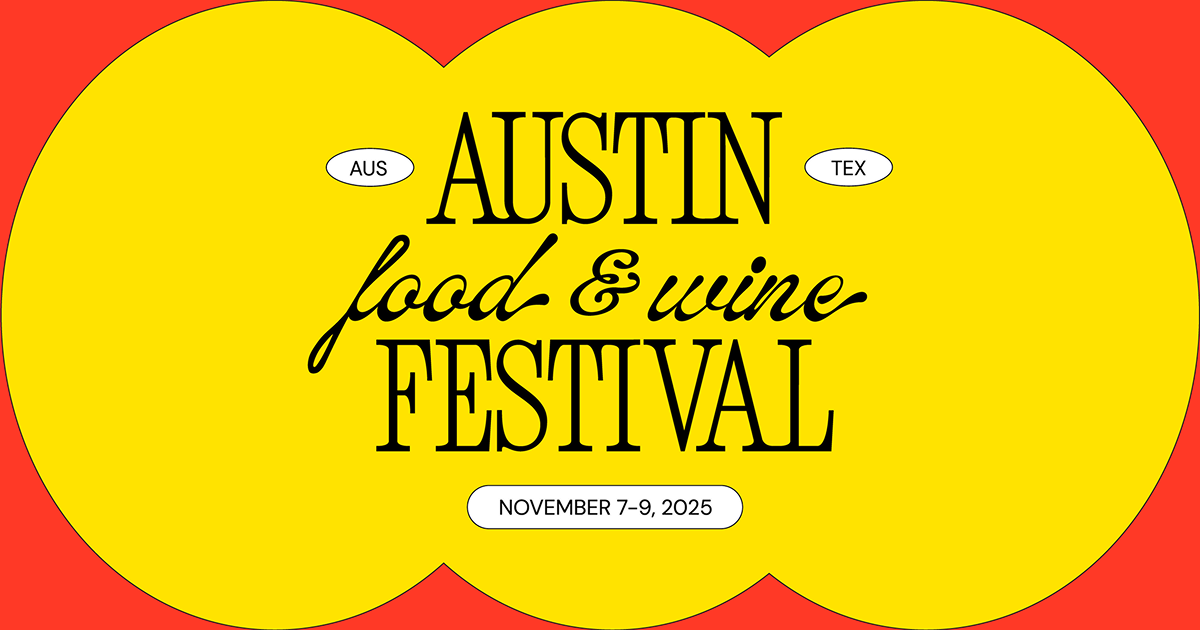 Austin Food and Wine Festival tasting tent with downtown Austin skyline
