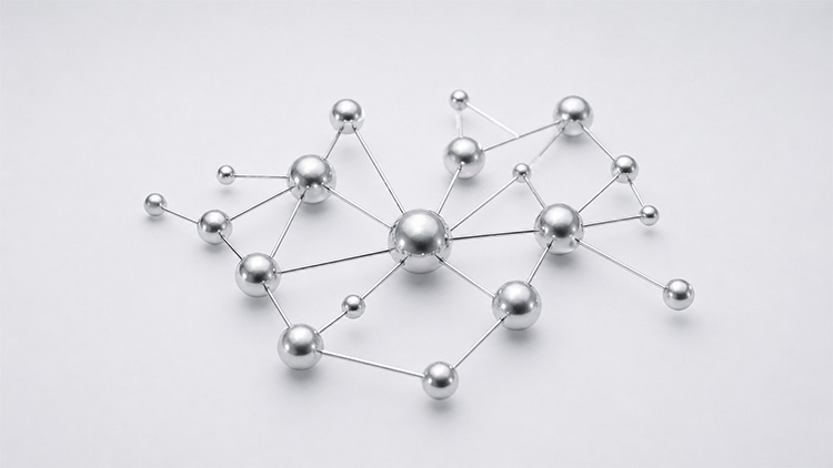 Metallische Kugeln unterschiedlicher Größe, verbunden durch dünne Stäbe, als Modell eines Molekülnetzwerks.