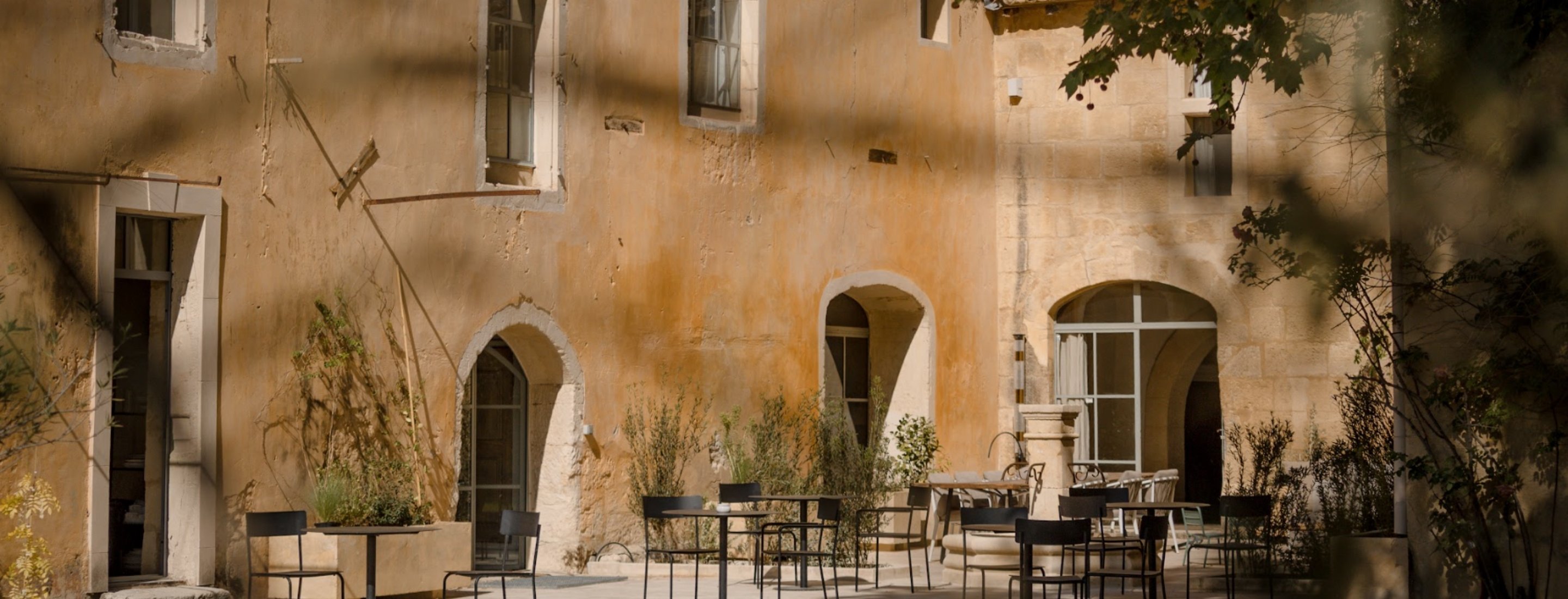 Stone facade of the Mas des Prêcheurs hotel, in Tarascon in Provence, authentic architecture and Provençal charm.