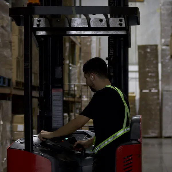 Reach truck operator moving cartons for Amazon FBA shipments