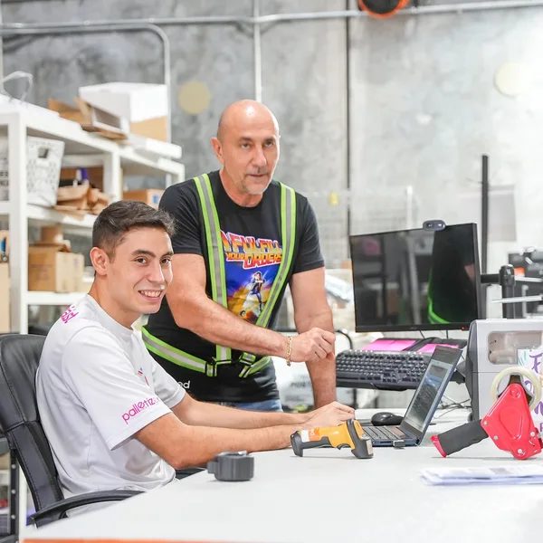 Pack station processing orders from several online stores