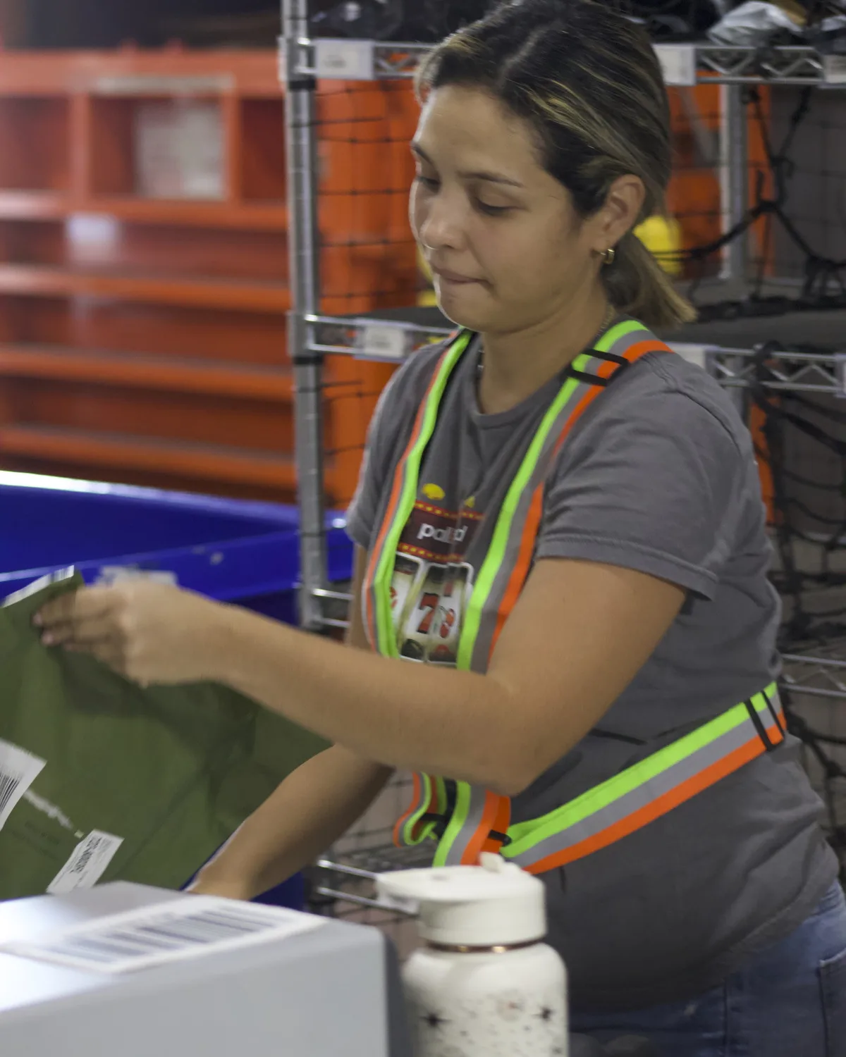 Team member inspecting accessories on a receiving table