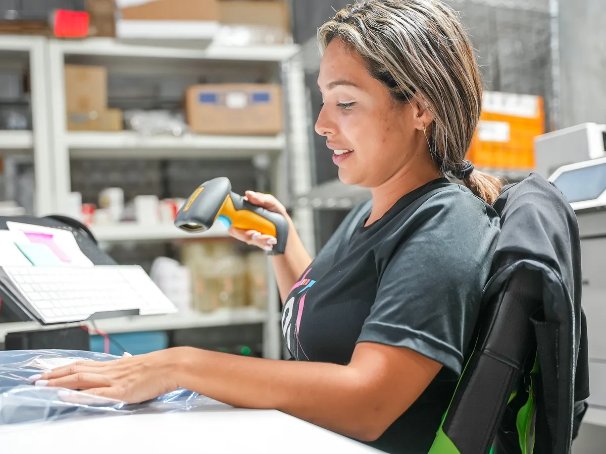 Team member scanning and counting an inbound shipment