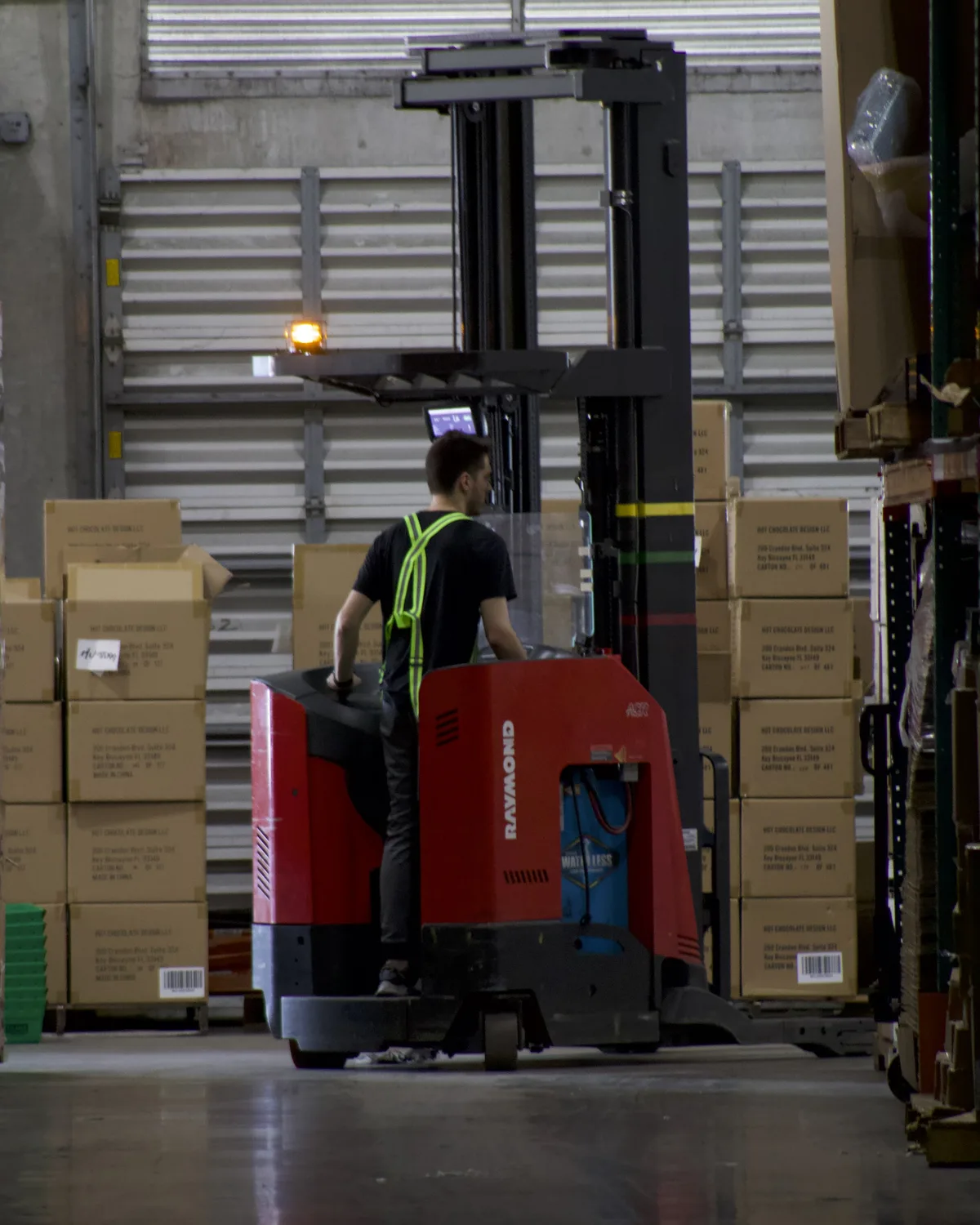 Pallets of cartons staged for retail orders at the Doral eHub
