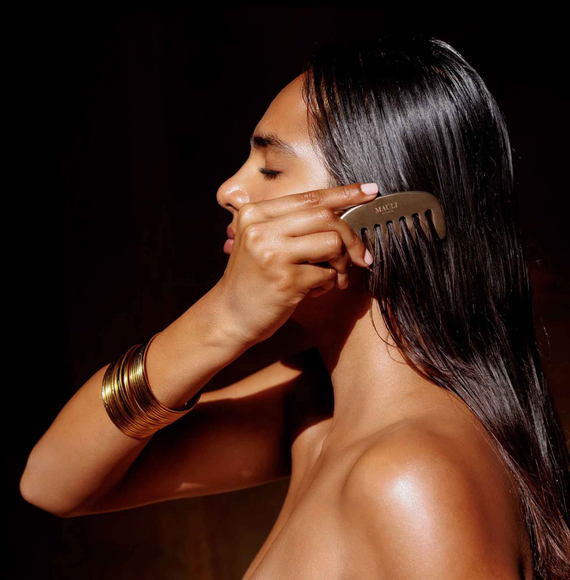 woman combing her hair