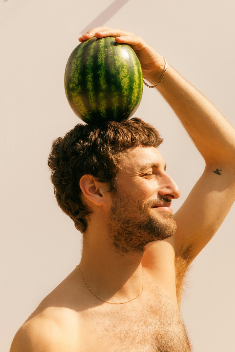man with watermelon on head