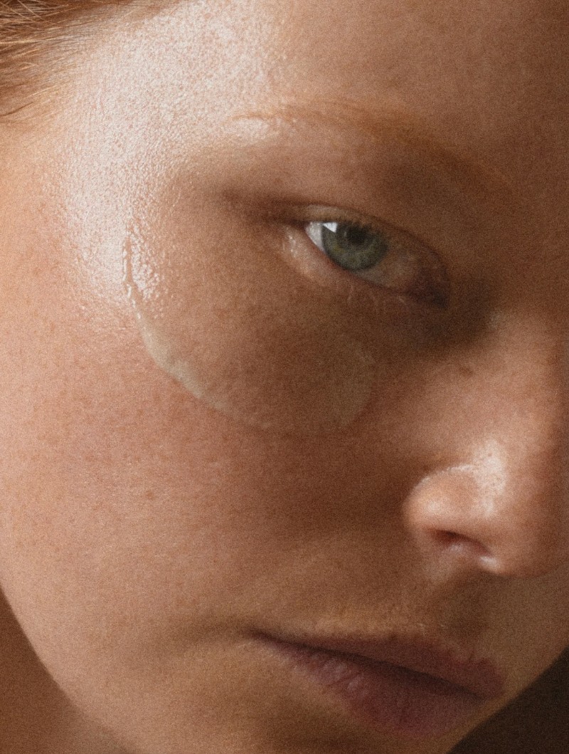 close up on womans face with serum on