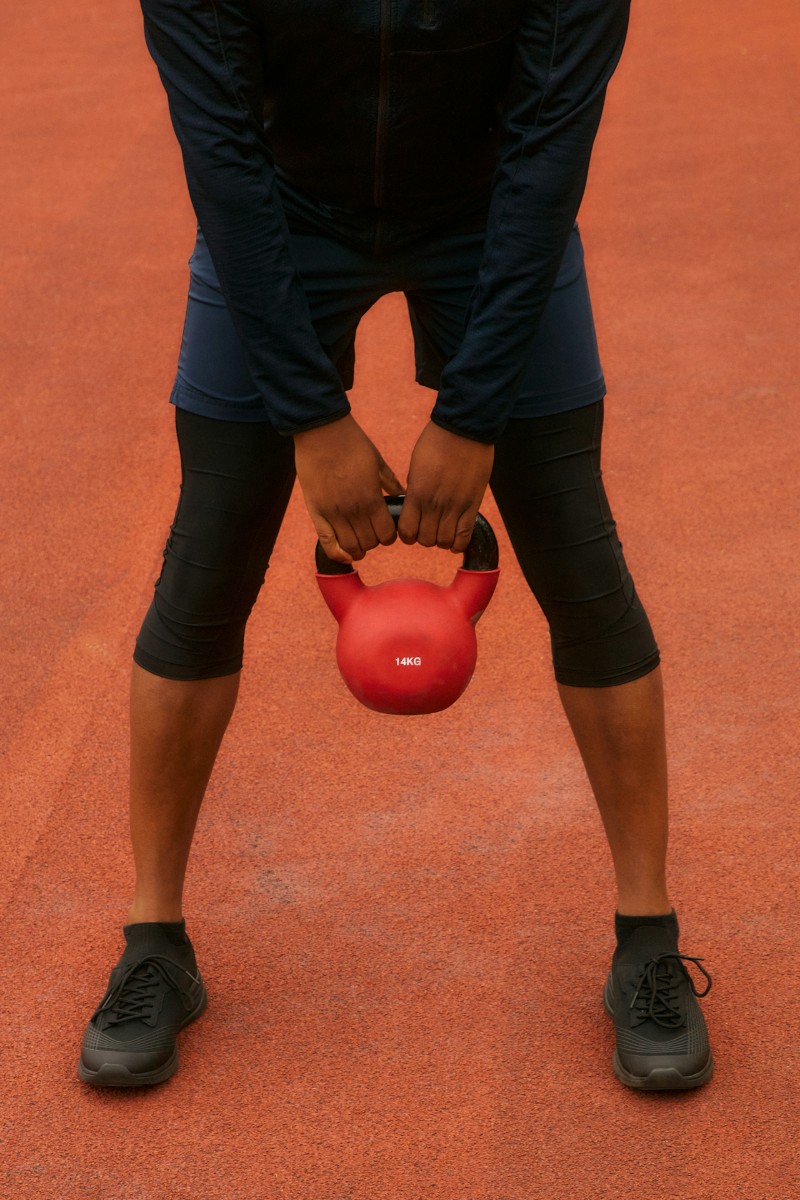 man holding kettlebell