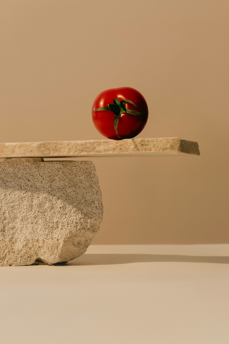 tomato on grey slate and cream background