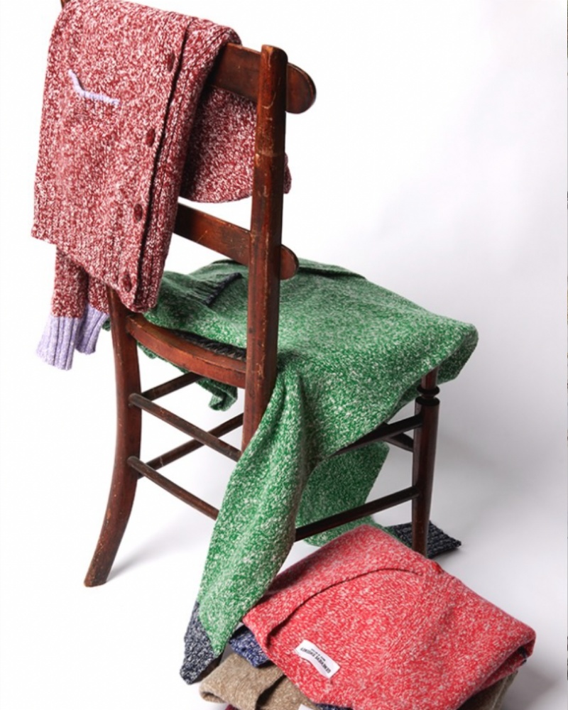 wooden chair with jumpers on it