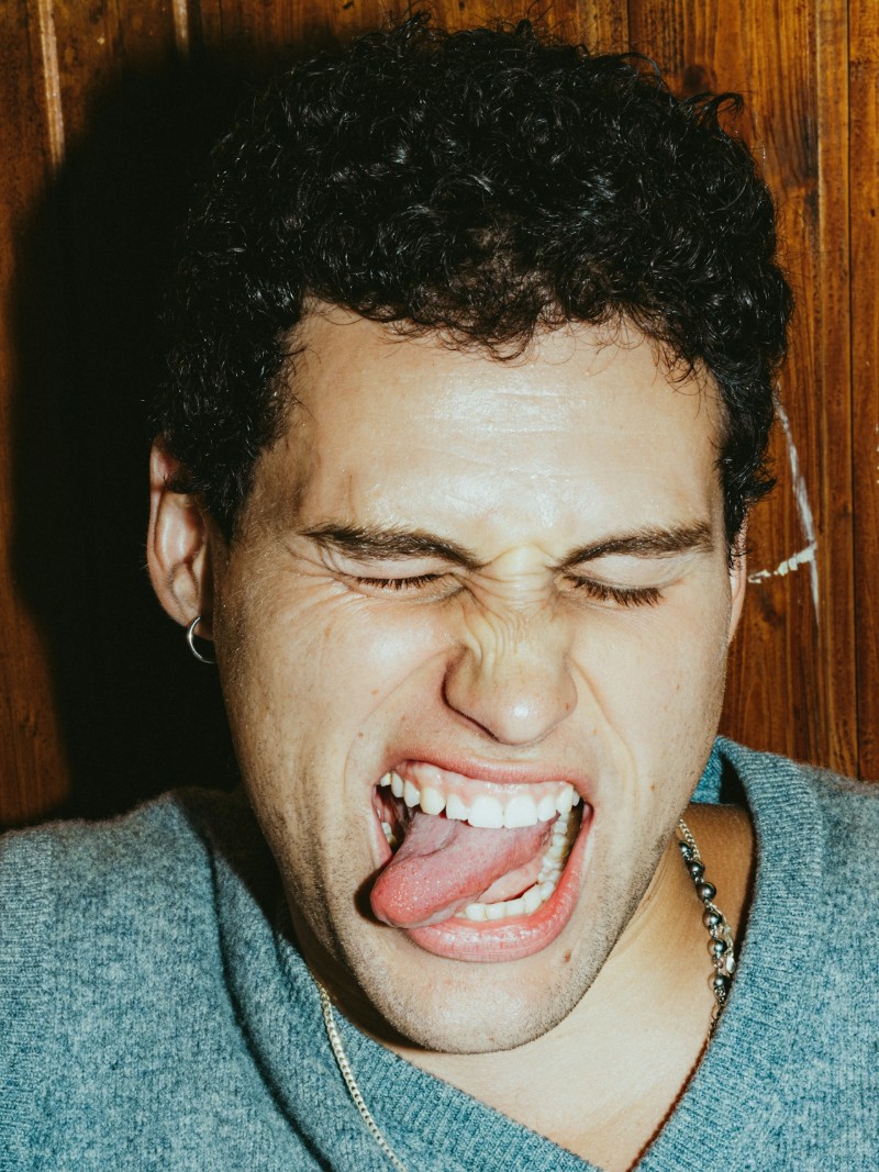 Man pulling silly face with tongue out