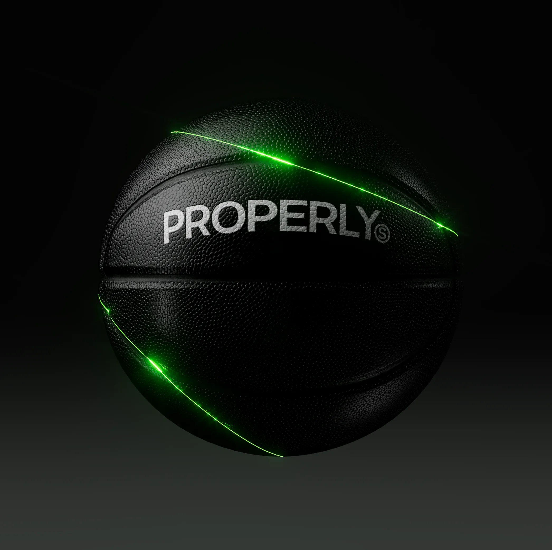 Black basketball with textured surface and the word 'PROPERLY' lit by glowing green lines on a dark background.