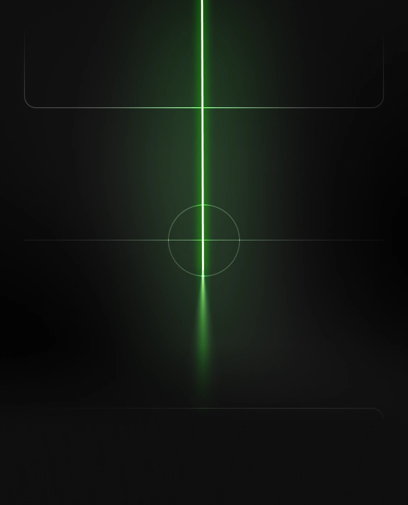 Vertical bright green laser beam with glowing circle on a dark background.