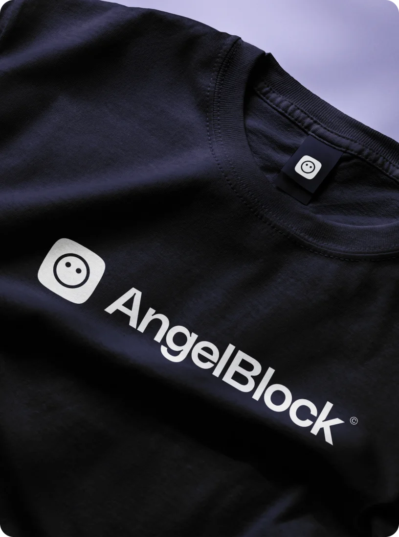 Black t-shirt with AngelBlock logo and text printed in white.