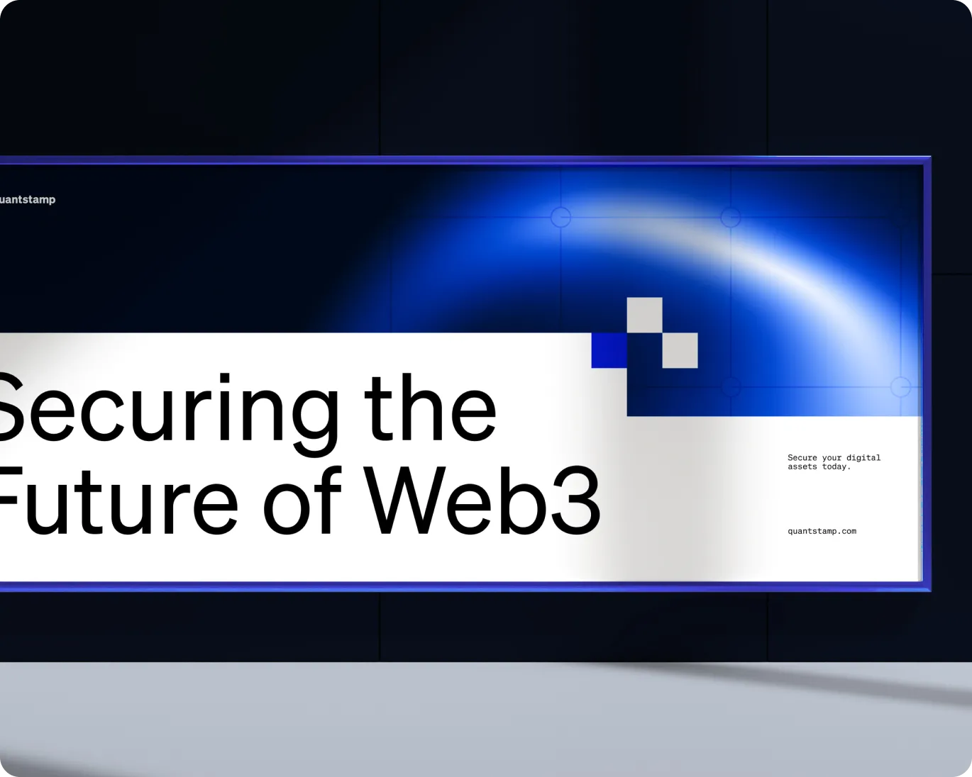 Digital billboard displaying the message 'Securing the Future of Web3' with a blue geometric design and the text 'Secure your digital assets today. quantstamp.com'.