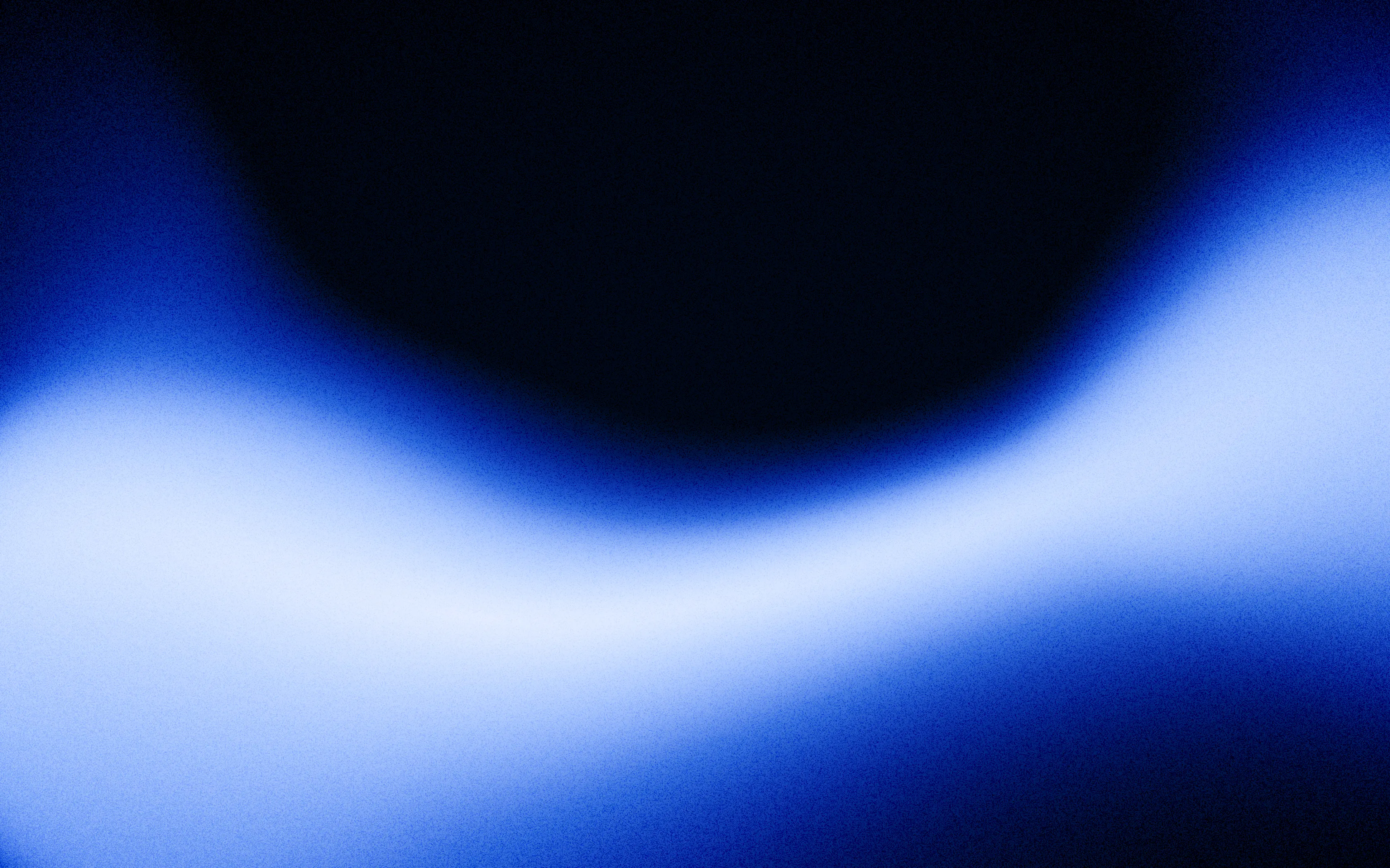 Abstract gradient with a smooth wave-like transition from deep blue to light blue and black.