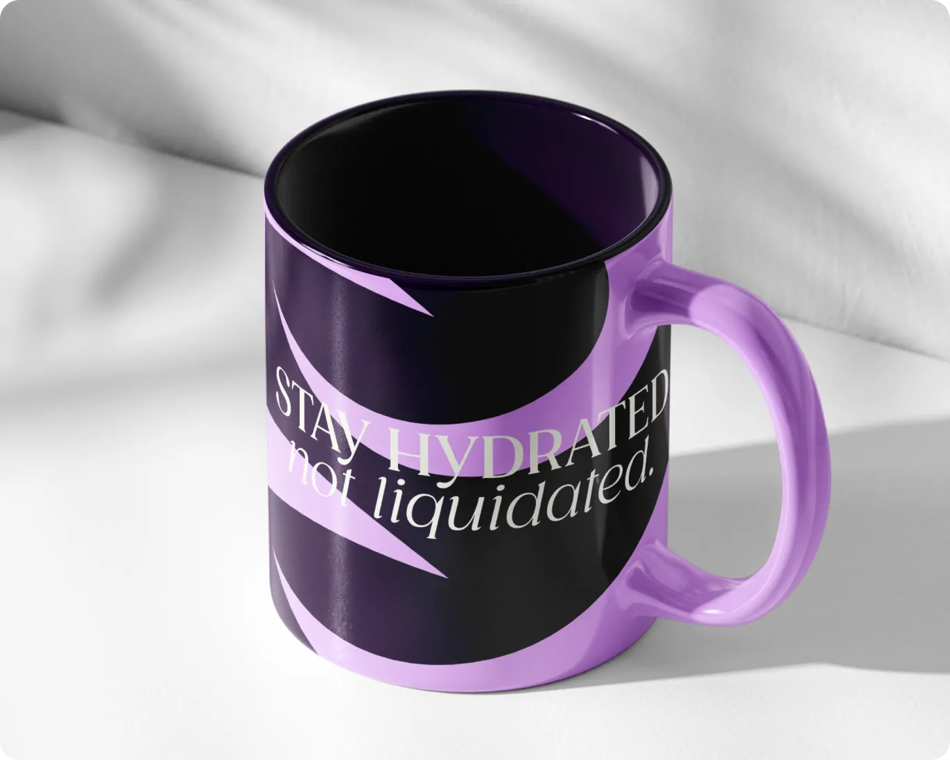 Purple and black ceramic mug with the phrase 'Stay hydrated not liquidated.' printed on it.