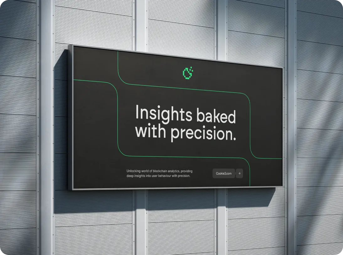 Billboard on a gray wall displaying text: 'Insights baked with precision. Unlocking world of blockchain analytics, providing deep insights into user behaviour with precision.'