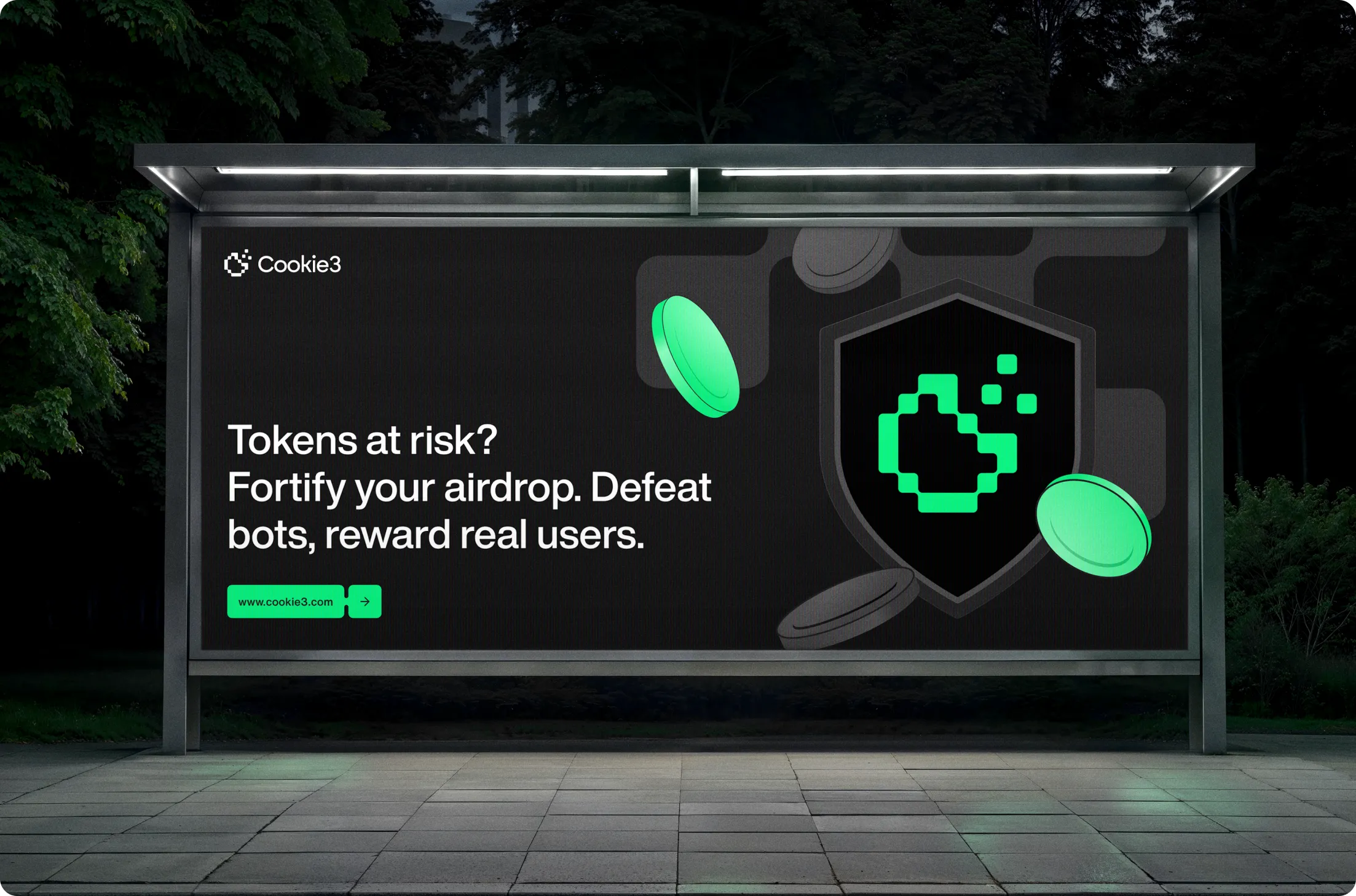 Bus stop billboard at night with Cookie3 logo and text: Tokens at risk? Fortify your airdrop. Defeat bots, reward real users, with website link www.cookie3.com.