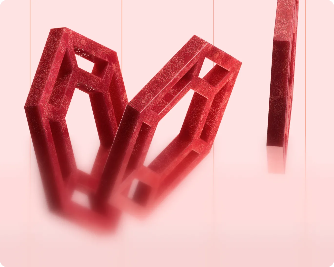 Three translucent red geometric shapes suspended on strings against a pink background, with soft shadows below.