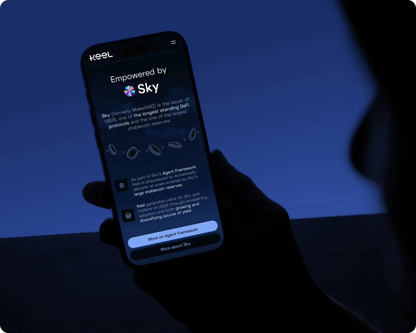 Person holding a smartphone displaying a page about Keel being empowered by Sky, highlighting stablecoin reserves and yield generation.