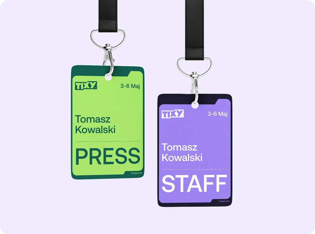 Two event badges hanging from black lanyards; a green PRESS badge and a purple STAFF badge, both with the name Tomasz Kowalski and dates 3-6 Maj.