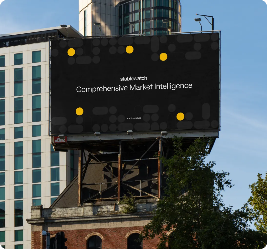 Large billboard on a building displaying 'stablewatch Comprehensive Market Intelligence' on a black background with yellow dots.