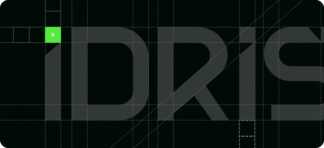 Close-up of dark gray stylized text reading 'IDRIS' partially obscured by a grid and a small green square with a white 'x' in the top left corner.