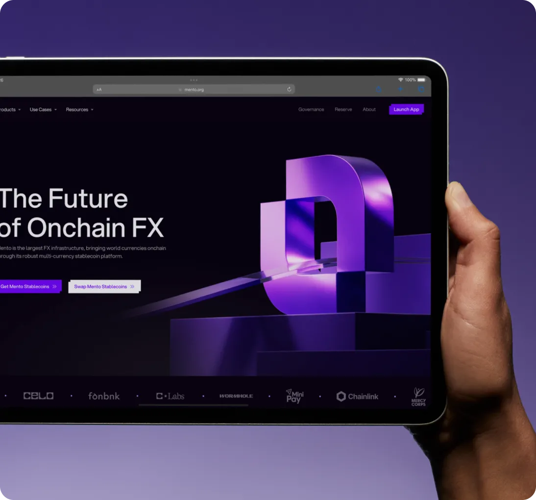 Hand holding a tablet displaying a website with text 'The Future of Onchain FX' and a large purple 3D logo.
