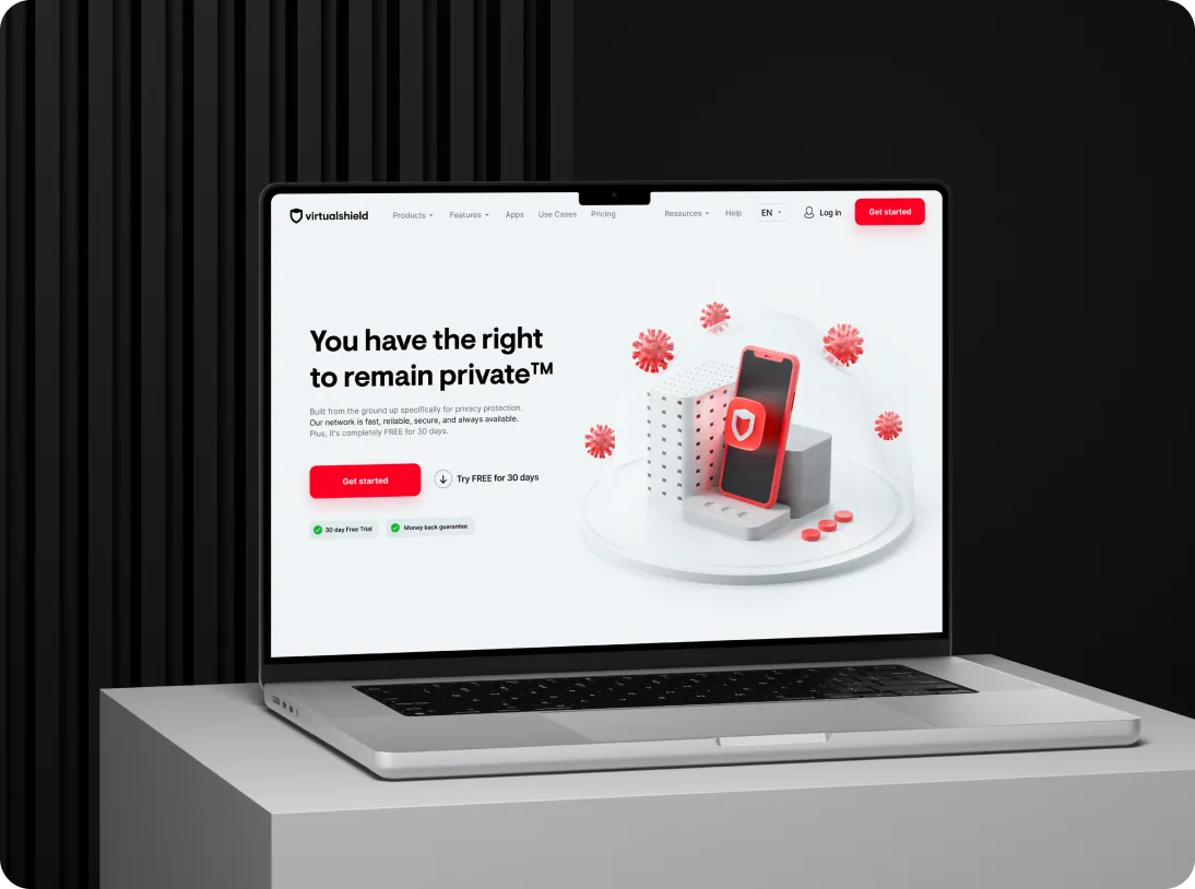 Laptop displaying Virtualshield website homepage with the text 'You have the right to remain private™' and a 3D graphic of a smartphone surrounded by red virus-like icons.