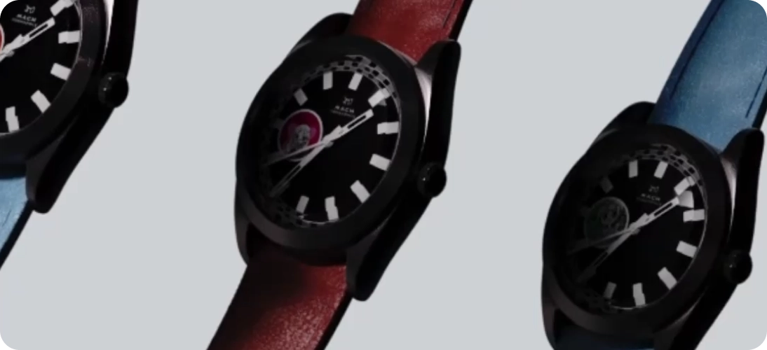 Three wristwatches with black dials and large white hour markers, featuring red and blue leather straps.