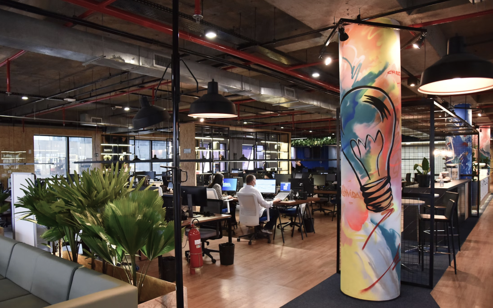 Open office layout with desks and plants