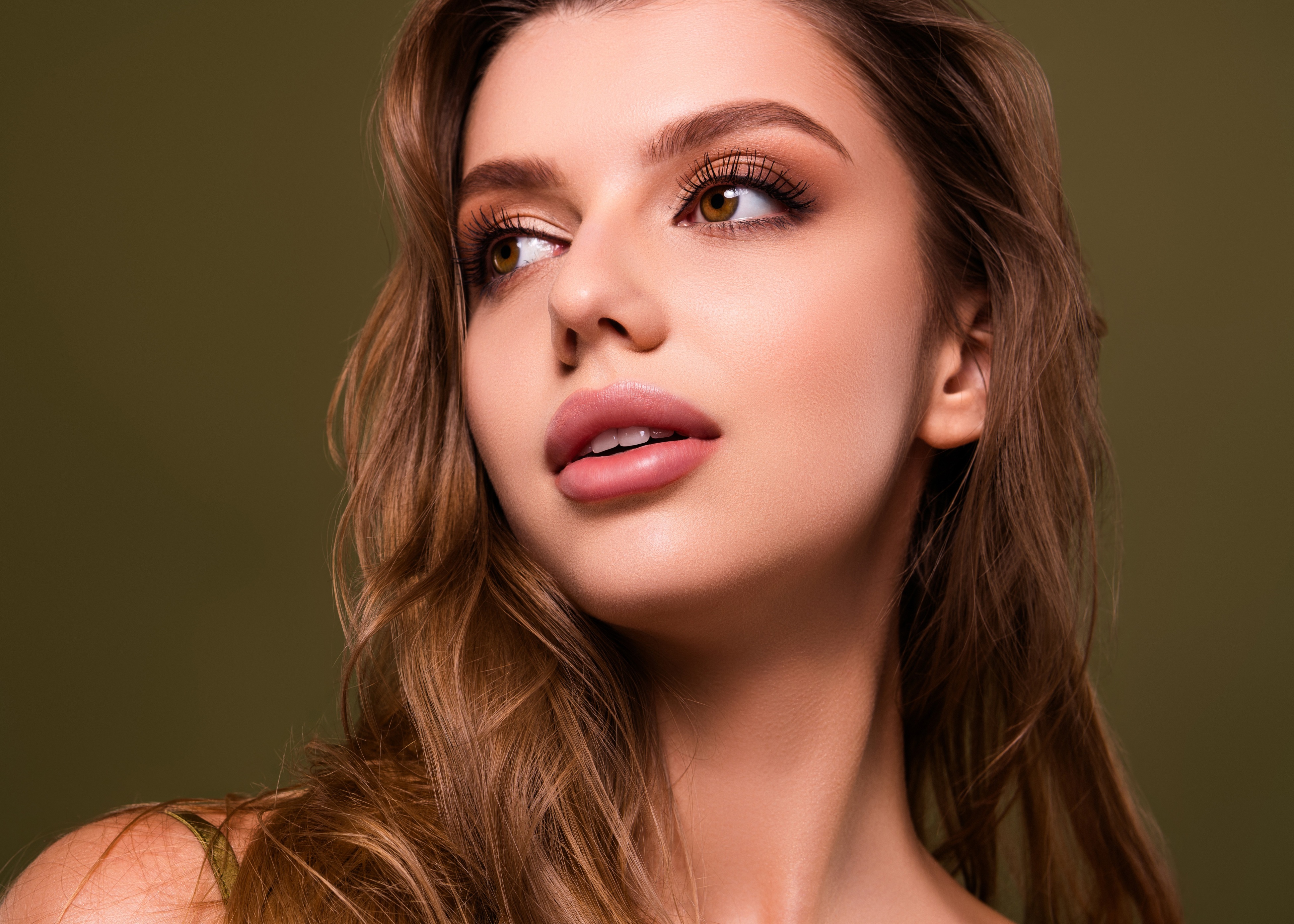 A woman smiling looking to the left