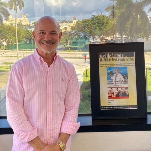Dr. Rao showing his books on how bio-hrt can help "not feeling like myself"