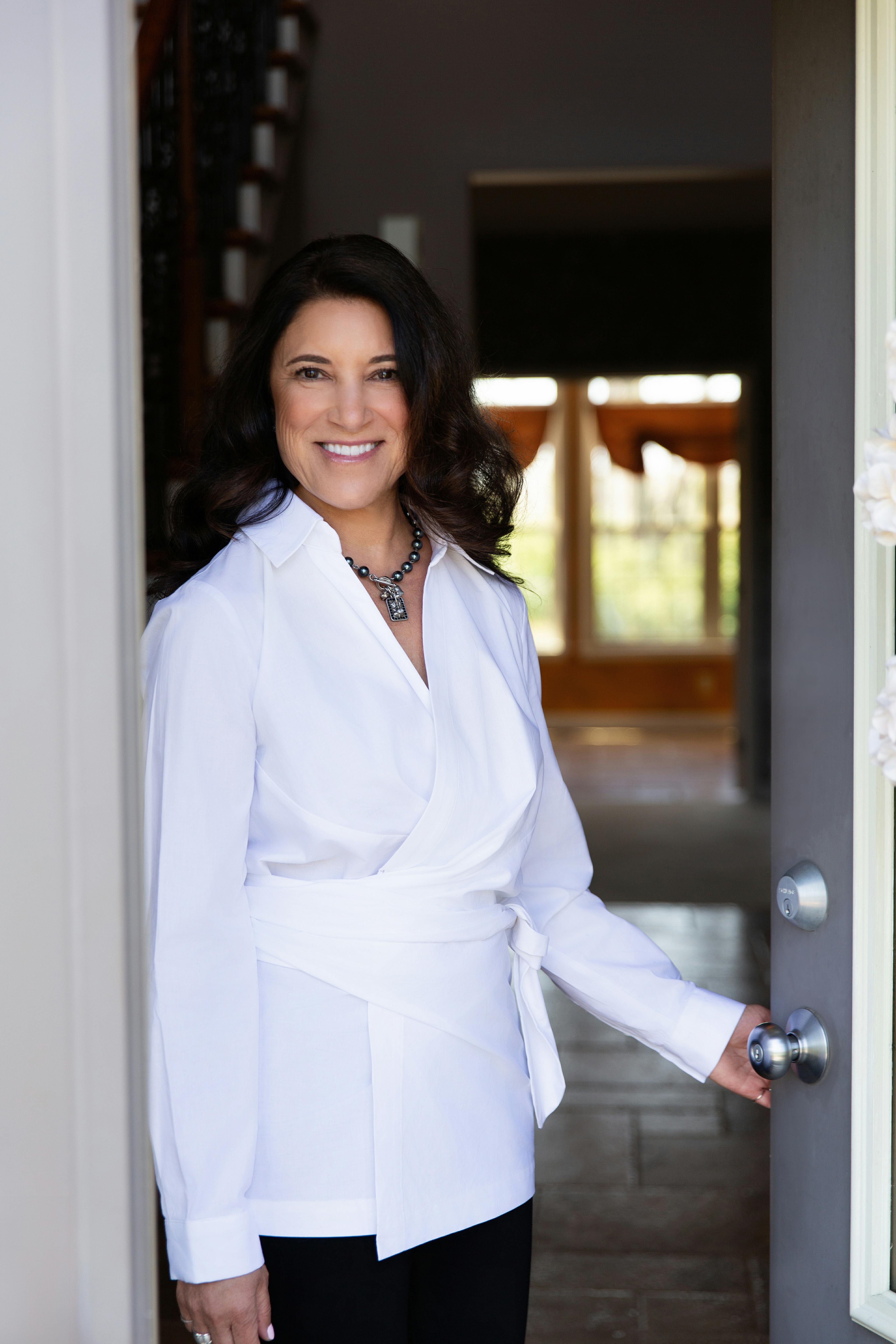 Dr. Samantha Greeting Client at the door