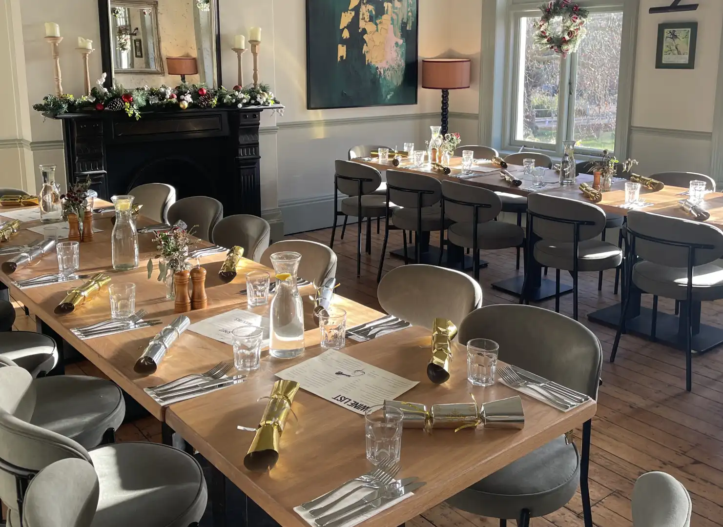 The Greyhound Kew dining room decorated for Christmas, overlooking Kew Green